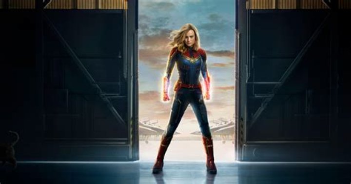 Captain Marvel (Brie Larson) holds back a hammer with a single glowing hand in 'The Marvels'