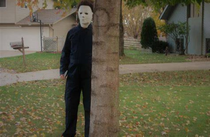 Michael Myers is standing in a hotel room.
